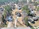 Aerial view of the property showcasing the home's layout, surrounding landscape, and neighborhood at 8870 Dornoch Cir, Winston, GA 30187