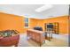 Spacious finished basement featuring a foosball table, cozy seating, and ample entertainment space at 8870 Dornoch Cir, Winston, GA 30187