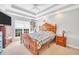 Bedroom featuring coffered ceilings, large window, wood furniture, and ample natural light at 8870 Dornoch Cir, Winston, GA 30187