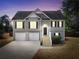 Charming two-story home features a two-car garage and inviting front porch with a well-maintained lawn at 8870 Dornoch Cir, Winston, GA 30187
