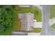 Aerial view of a single-Gathering home with a driveway and a well-maintained lawn and surrounded by lush greenery at 1087 Berkley Se Dr, Smyrna, GA 30082