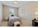 Bright bedroom with natural light, carpeted floors, neutral walls and modern furnishings create a relaxing atmosphere at 1087 Berkley Se Dr, Smyrna, GA 30082