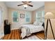 Bright bedroom with hardwood floors, natural light, a queen-size bed, and closet space at 1087 Berkley Se Dr, Smyrna, GA 30082