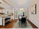 Elegant dining room featuring hardwood floors and a seamless transition to the kitchen at 1087 Berkley Se Dr, Smyrna, GA 30082