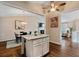Open floor plan showing kitchen island, fireplace, dining, and living area at 1087 Berkley Se Dr, Smyrna, GA 30082
