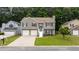 Charming two-story home featuring a well-maintained lawn and inviting front entrance at 1087 Berkley Se Dr, Smyrna, GA 30082