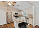Open kitchen featuring granite countertops, stainless appliances, and a functional island at 1087 Berkley Se Dr, Smyrna, GA 30082