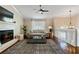 Inviting living room with a fireplace, hardwood floors, and neutral color palette at 1087 Berkley Se Dr, Smyrna, GA 30082