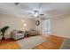 Living room with hardwood floors, neutral walls, recessed lights, and a ceiling fan with seating area at 1087 Berkley Se Dr, Smyrna, GA 30082