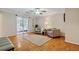 Inviting living space with sliding doors providing access to the bedroom, hardwood floors and neutral paint at 1087 Berkley Se Dr, Smyrna, GA 30082