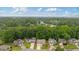 Scenic neighborhood view with lush greenery, featuring charming homes with inviting driveways and well-maintained landscapes at 1087 Berkley Se Dr, Smyrna, GA 30082