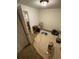 Untidy bedroom featuring miscellaneous items and a tan carpet covering the floor at 2463 Stone Rd, East Point, GA 30344