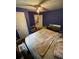 Bedroom with unique blue walls, ceiling fan, and window with lots of light at 2463 Stone Rd, East Point, GA 30344