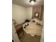 Untidy bedroom featuring miscellaneous items and a tan carpet covering the floor at 2463 Stone Rd, East Point, GA 30344
