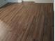 Close up of damaged wood laminate flooring at 2463 Stone Rd, East Point, GA 30344
