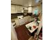 Bright kitchen with white cabinets, tile backsplash, and modern appliances at 2463 Stone Rd, East Point, GA 30344