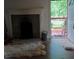 Living room with stone fireplace and access to a deck at 2463 Stone Rd, East Point, GA 30344