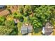 Aerial view of a landscaped backyard with patio and lush greenery surrounding the property at 285 Sw Martin Sw Way, Marietta, GA 30064