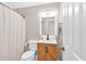 This well-lit bathroom features a modern vanity, framed mirror, and a convenient shower curtain at 285 Sw Martin Sw Way, Marietta, GA 30064