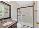 Renovated bathroom with a glass-enclosed shower, granite vanity and stylish fixtures at 285 Sw Martin Sw Way, Marietta, GA 30064