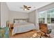 Bright bedroom with a large window for natural light, alongside a work space and hardwood floors at 285 Sw Martin Sw Way, Marietta, GA 30064