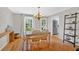 Charming dining room featuring a classic chandelier, hardwood floors, and a view into the kitchen, ideal for Gathering meals at 285 Sw Martin Sw Way, Marietta, GA 30064
