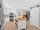 Modern kitchen featuring white cabinetry, stainless steel appliances, and a butcher block island with seating, designed for cooking and dining at 285 Sw Martin Sw Way, Marietta, GA 30064