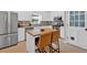 Bright kitchen with stainless steel appliances, a stylish island, and ample cabinet space, perfect for preparing gourmet meals at 285 Sw Martin Sw Way, Marietta, GA 30064