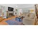 Inviting living room with a cozy fireplace, built-in bookshelves, and comfortable seating, perfect for relaxation and entertaining at 285 Sw Martin Sw Way, Marietta, GA 30064