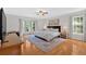 This spacious main bedroom features a large bed and windows providing ample natural light at 285 Sw Martin Sw Way, Marietta, GA 30064