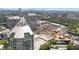 Scenic aerial view of the city showcasing lush green surroundings and modern buildings at 3338 Peachtree Rd # 2005, Atlanta, GA 30326