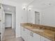 Elegant bathroom featuring double sinks, granite countertop, and a large mirror at 3338 Peachtree Rd # 2005, Atlanta, GA 30326