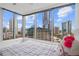 Bedroom offering breathtaking city views from its expansive windows and a comfy white bed at 3338 Peachtree Rd # 2005, Atlanta, GA 30326