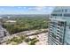 Expansive Buckhead cityscape featuring views of lush green trees and modern glass high rises on a clear day at 3338 Peachtree Rd # 2005, Atlanta, GA 30326