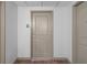 Neutral-toned hallway featuring a unit entrance, and clean white walls, and modern flooring at 3338 Peachtree Rd # 2005, Atlanta, GA 30326