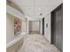 Hallway with tile floors, modern elevators, and artwork for a luxurious feel at 3338 Peachtree Rd # 2005, Atlanta, GA 30326