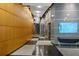 Hallway with wood panels, tile floors, elevators, and a screen showing 'THE POOL IS OPEN' at 3338 Peachtree Rd # 2005, Atlanta, GA 30326