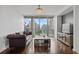 Spacious living room with hardwood floors, a modern chandelier, and large windows boasting skyline views at 3338 Peachtree Rd # 2005, Atlanta, GA 30326