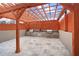 Inviting outdoor kitchen area with a built-in grill, countertop space, and wooden pergola perfect for entertaining at 3338 Peachtree Rd # 2005, Atlanta, GA 30326