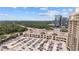Lush outdoor shopping center with ample parking on a bright day near modern high rises and green forest at 3338 Peachtree Rd # 2005, Atlanta, GA 30326