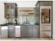 Stylish bar area with modern cabinets, open shelves, mosaic tile backsplash, and stainless steel wine cooler at 3925 Sheldon Ne Dr, Atlanta, GA 30342