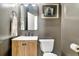Bathroom features a wooden vanity, stylish mirror and modern fixtures in a compact space at 3925 Sheldon Ne Dr, Atlanta, GA 30342
