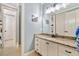 Bathroom boasts granite counters, white cabinets, and framed mirror providing style and ample storage at 3925 Sheldon Ne Dr, Atlanta, GA 30342