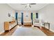 Bright bedroom featuring a crib, glider chair, hardwood floors and generous space for Bedroom essentials at 3925 Sheldon Ne Dr, Atlanta, GA 30342