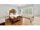 Bedroom with hard wood floors, large windows and natural light at 3925 Sheldon Ne Dr, Atlanta, GA 30342