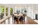 Bright breakfast nook features an eat-in table, views of backyard, and is adjacent to a kitchen with hardwood flooring throughout at 3925 Sheldon Ne Dr, Atlanta, GA 30342
