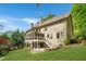 Spacious two-story home with a screened-in porch and well-manicured lawn at 3925 Sheldon Ne Dr, Atlanta, GA 30342