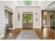 Elegant foyer with high ceilings, hardwood floors, and decorative lighting at 3925 Sheldon Ne Dr, Atlanta, GA 30342