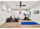 Bright home gym featuring wood floors, ceiling fan, and exercise equipment at 3925 Sheldon Ne Dr, Atlanta, GA 30342