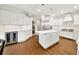 Modern kitchen with white cabinets, subway tile backsplash, stainless steel appliances, and large center island at 3925 Sheldon Ne Dr, Atlanta, GA 30342